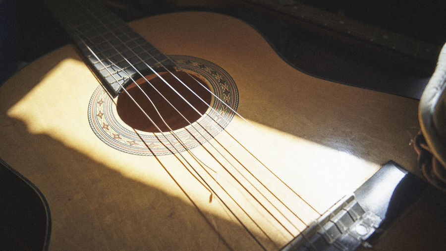 High angle view of guitar at home