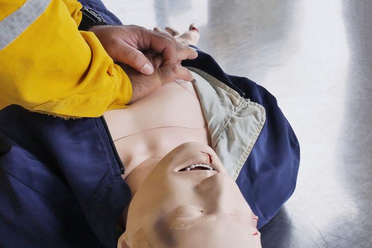 Cropped image of hands on mannequin