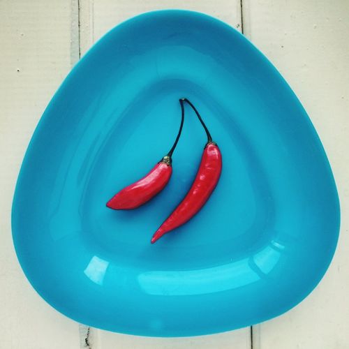 Close-up of red chili peppers in plate