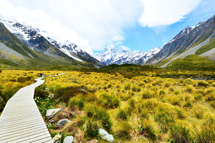 Boardwalk by snowcapped mountains at mt cook national park