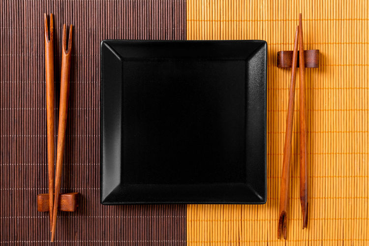 Asian food background with chopsticks top view with copy space.