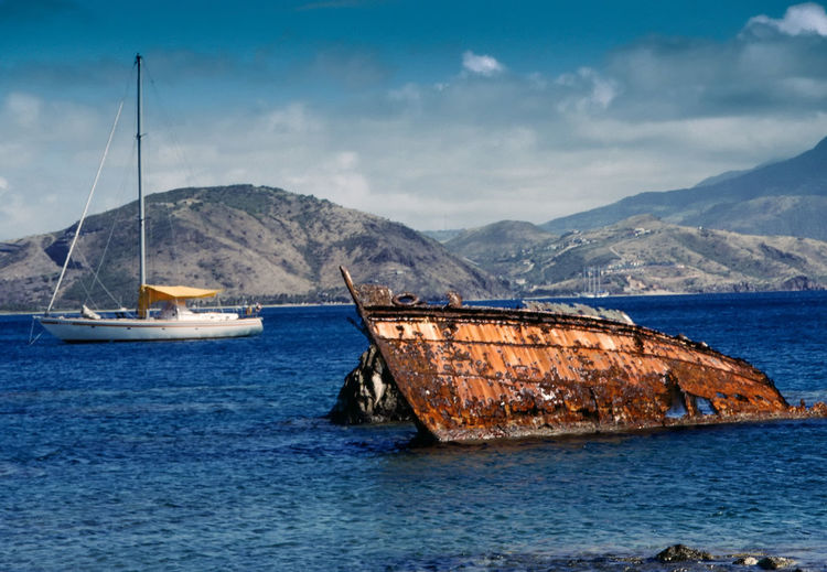 Rusted boats in the bay