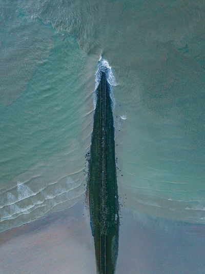 Directly above shot of pier at sea