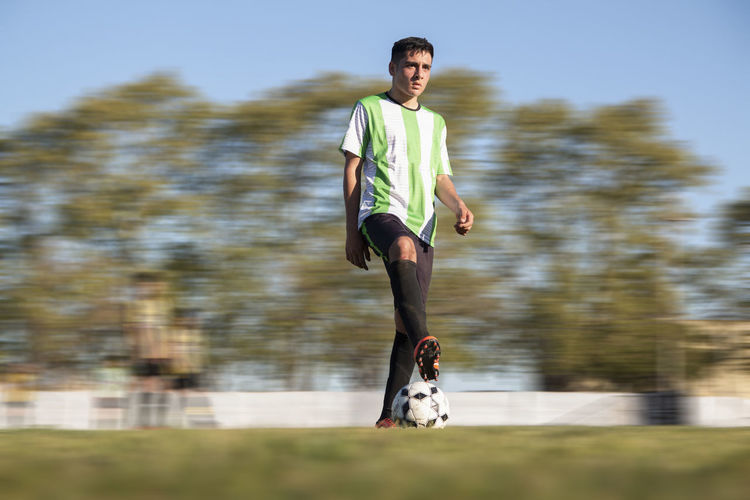 Portrait of soccer player in field