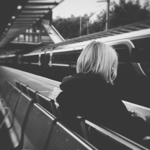 Woman waiting at railway station platform