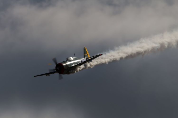 Low angle view of republic p-47 thunderbolt flying in sky