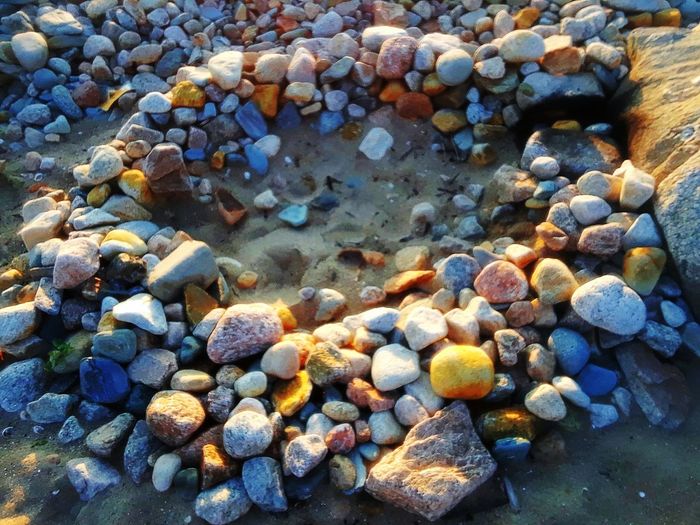 Close-up of pebbles on shore