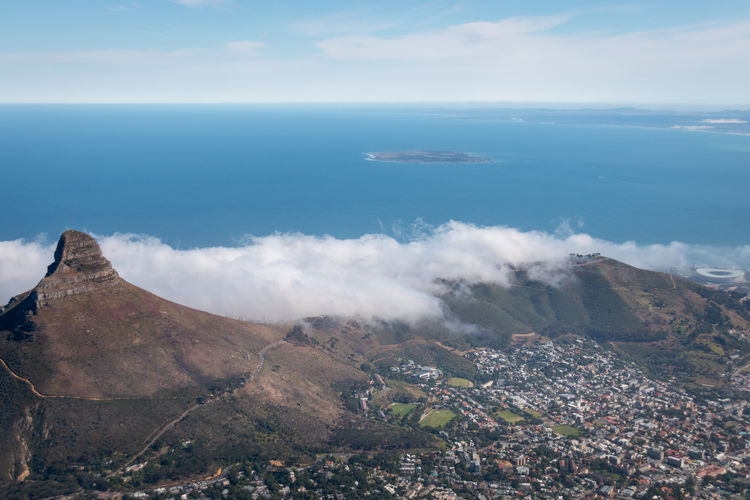 Scenic view of cape town and lions head, south africa from top of table mountain with robben island