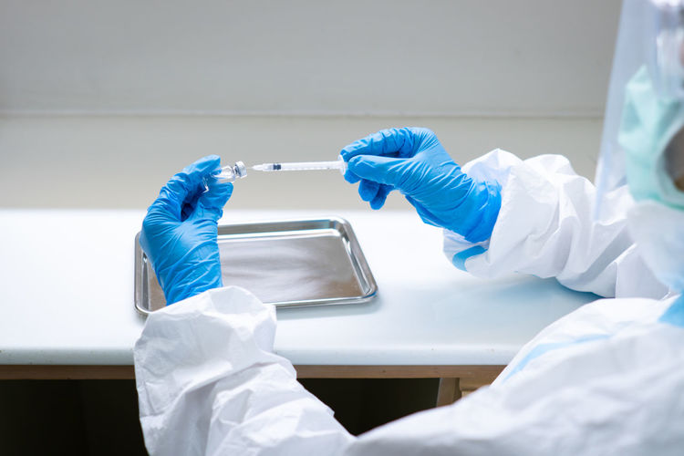 Rear view of scientist working on sample