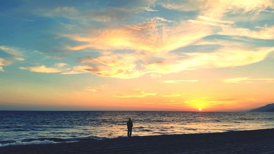 View of calm sea at sunset