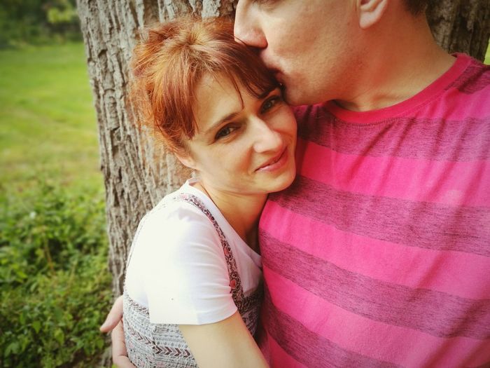 Portrait of couple kissing outdoors