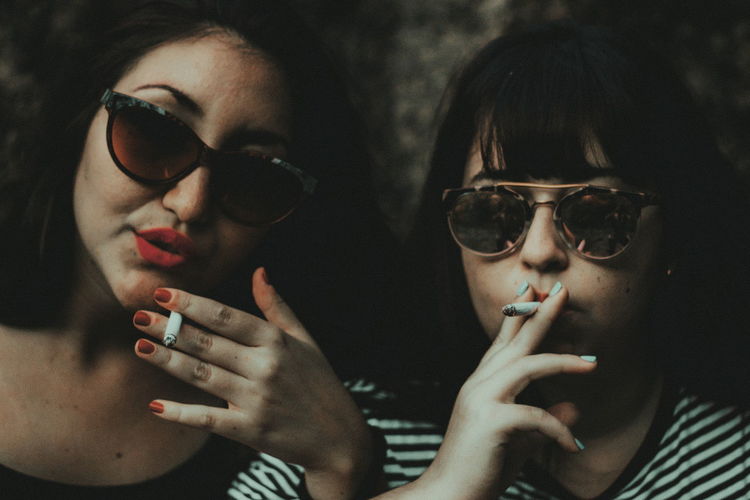 Strong femmes Only Women Human Face Eyeglasses Real People Beautiful Woman Best Of EyeEm EyeEm Of The Week Creative Photography Shadows & Lights Eye4photography The Week On EyeEm Lifestyles Young Woman Two People Young Adult Portrait Friends Cigarette Smoke