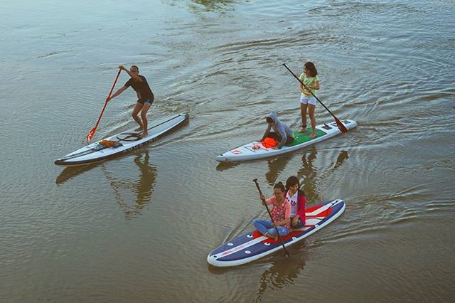 People kayaking in river