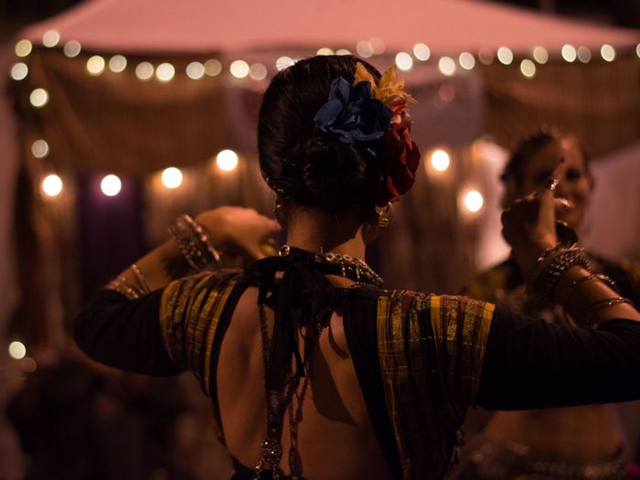Women performing traditional dance at night