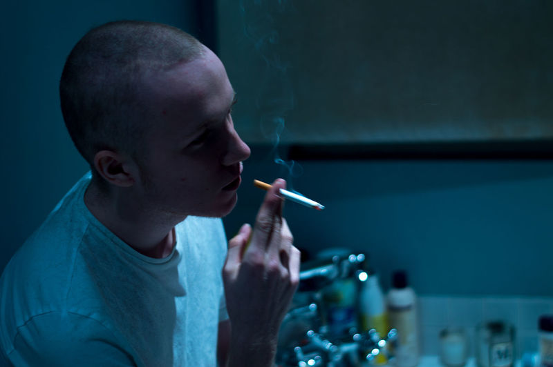 Adult Adults Only Bald Blue Close-up Cold Day Headshot Indoors Medical Cannabis Men Mood One Man Only One Person Only Men People Smoking - Activity