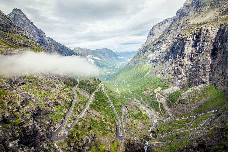 High angle view of road amidst mountains against sky
