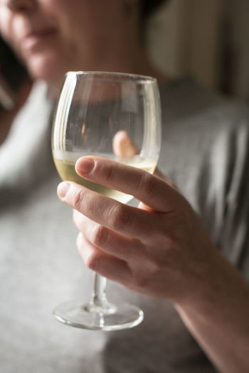 Close-up of man drinking glass