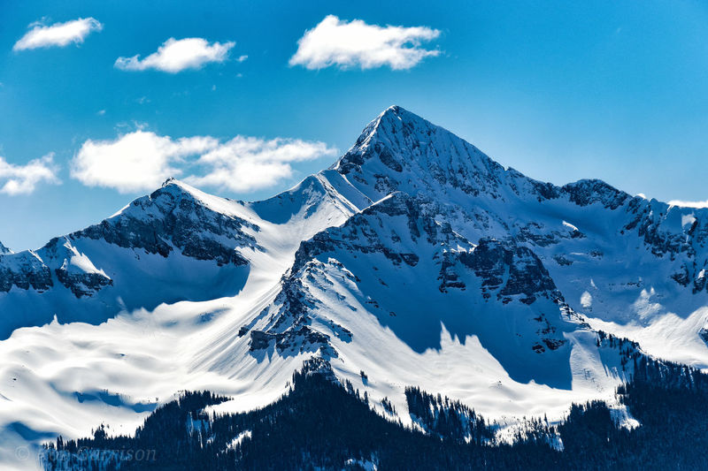 Scenic view of snow covered mountains against sky