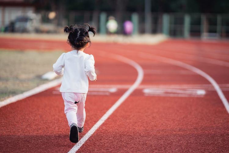 Rear view of boy running