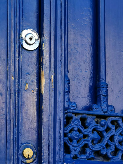 A blue door with double lock. security concept