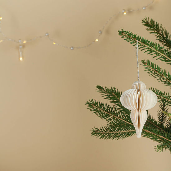 Christmas background with elegant christmas tree toy, garland. retro-style. minimalism. 