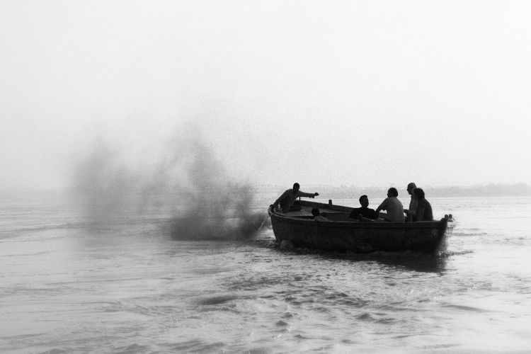 Men in a boat on lake