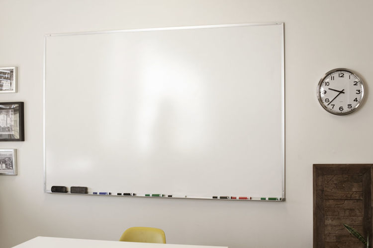Black whiteboard in creative office