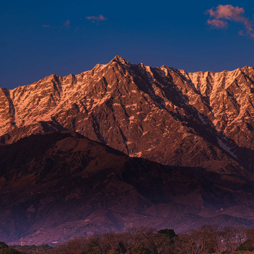 Scenic view of rocky mountain against sky