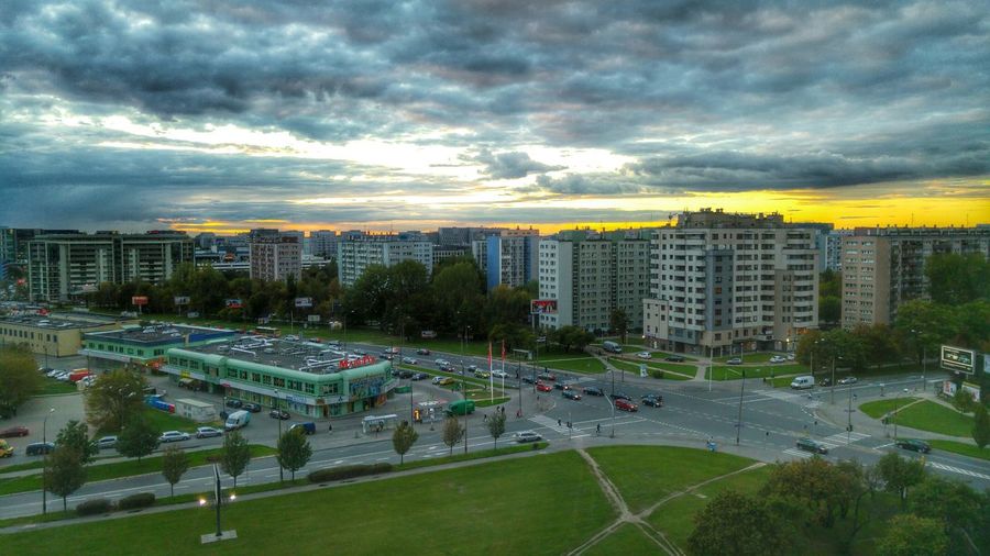 Cityscape against cloudy sky
