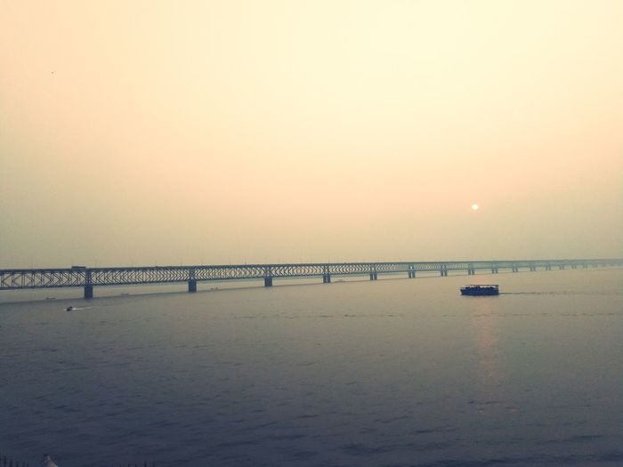 Scenic view of sea against clear sky during sunset