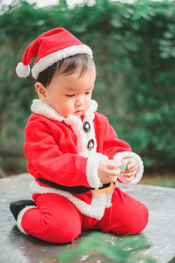 Cute baby girl wearing red hat