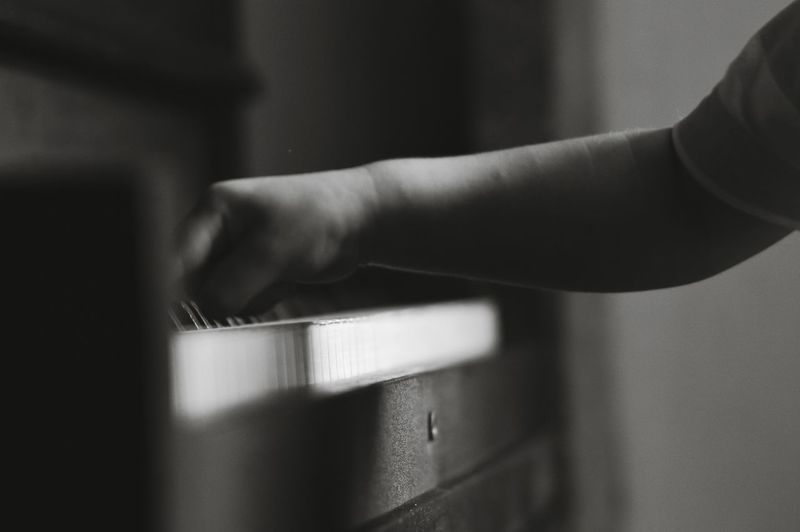 Cropped image of kid playing piano