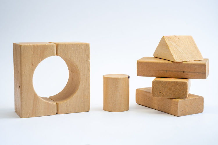 Close-up of wooden blocks on white background