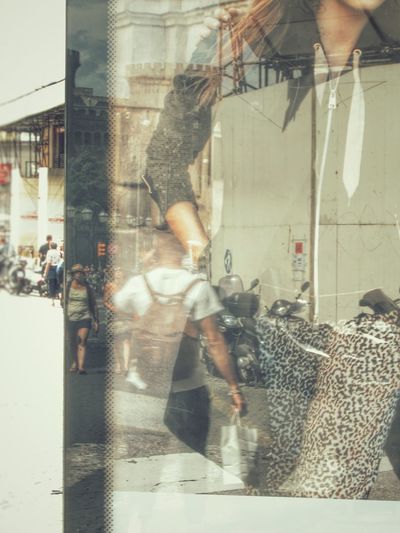 Double exposure of man and woman in city