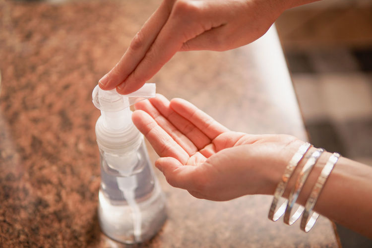 Close-up of woman hand holding bottle