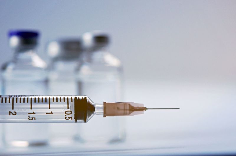 Close-up of syringe with vial