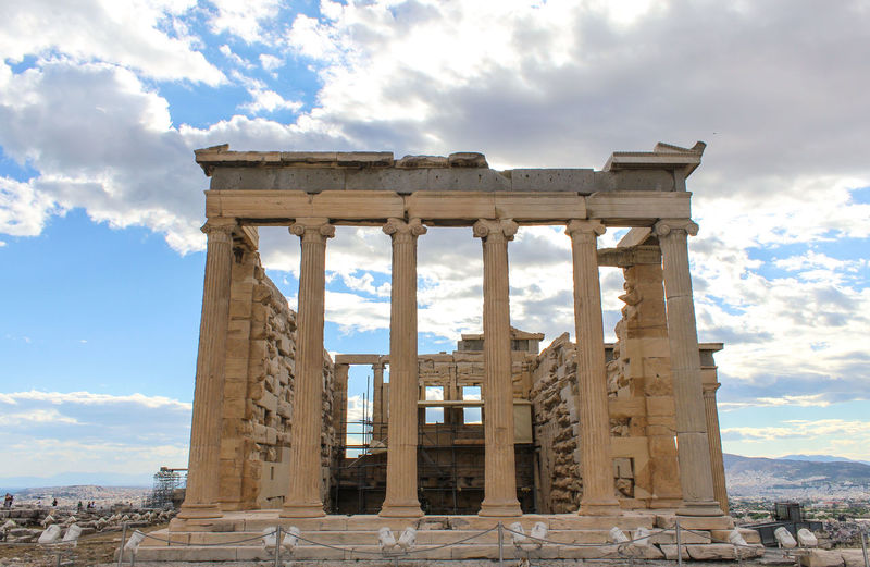 Historic monument at acropolis of athens against sky
