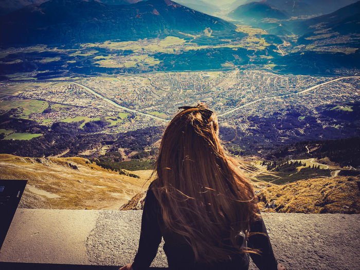 Woman looking at view of mountain range