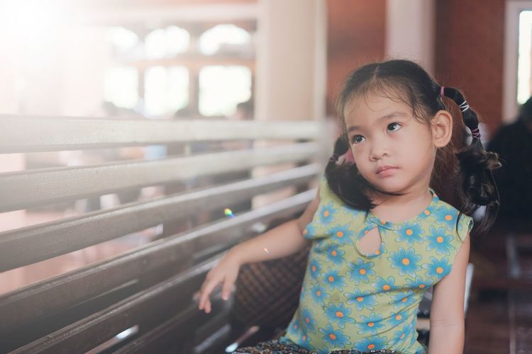 Portrait of cute girl looking away