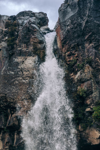 Water flowing through rocks in forest