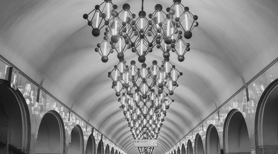 Low angle view of illuminated chandelier in moscow metro station mendeleevskaya 
