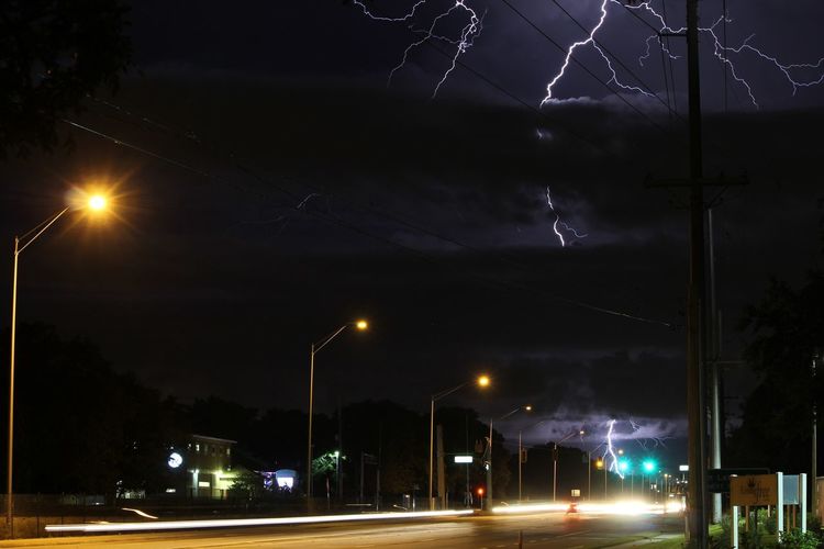 Illuminated street lights at night