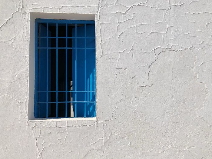 Full frame shot of window on wall of building