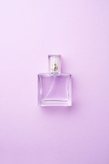 Close-up of electric lamp against pink background