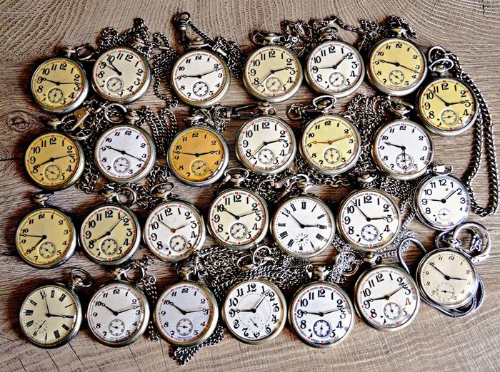 Directly above shot of pocket watches on wooden table