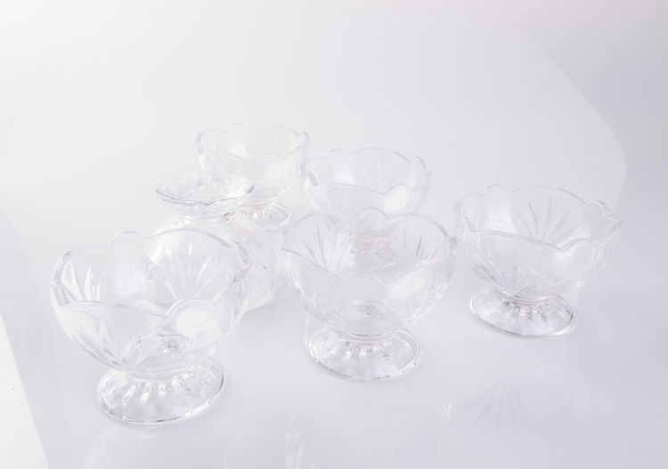High angle view of glassware on white background