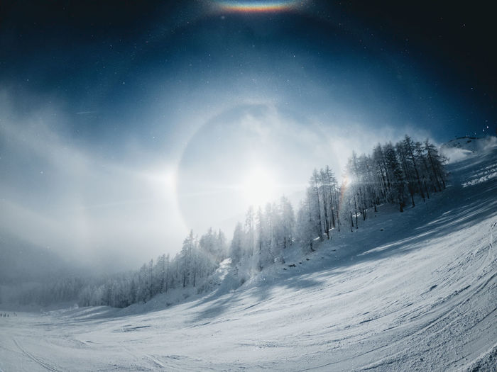 Sun halo on a cold winter day in the zauchensee ski resort, austria.