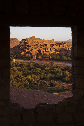 Old town and mountains seen through window