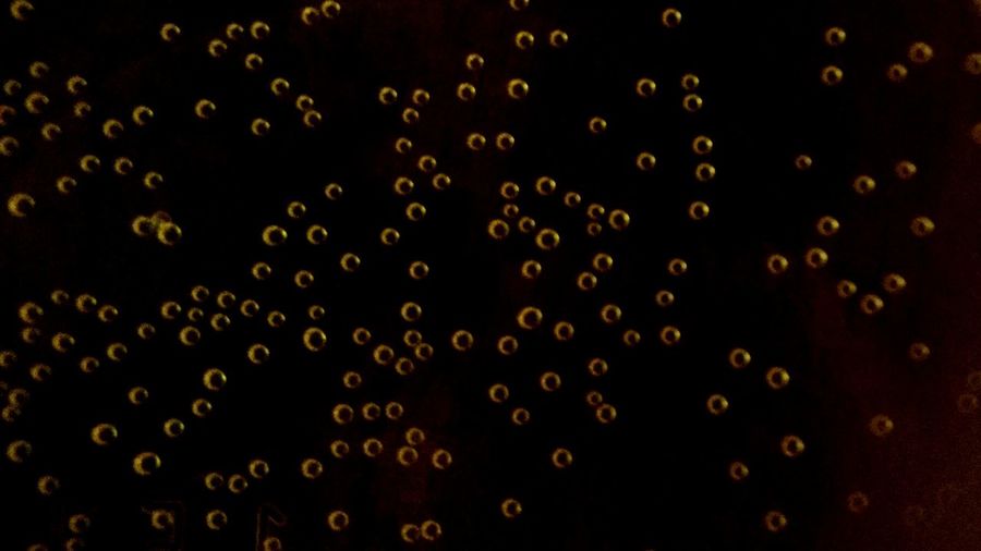 Close-up of abstract pattern against black background
