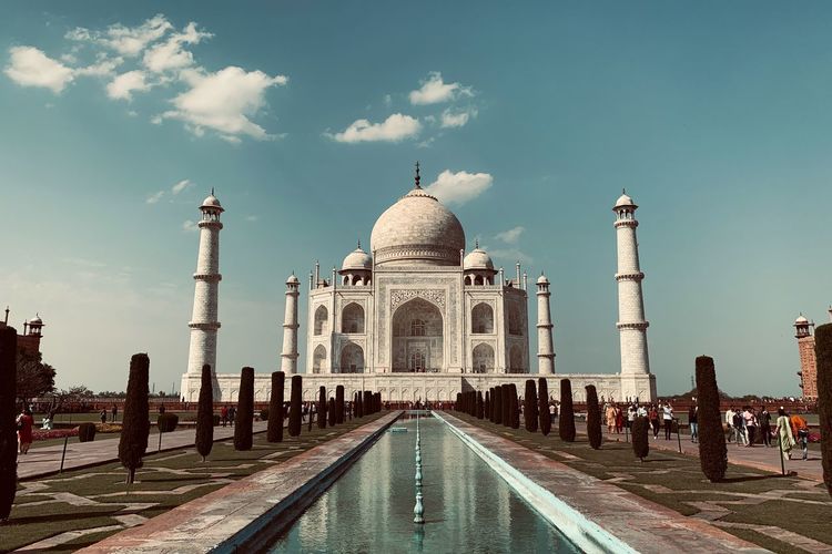 Taj mahal against cloudy sky